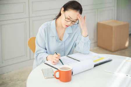 remote work, working at home concept of Asian woman in smart casual attire