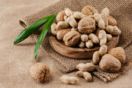 walnuts and peanuts on woven cloth, basket