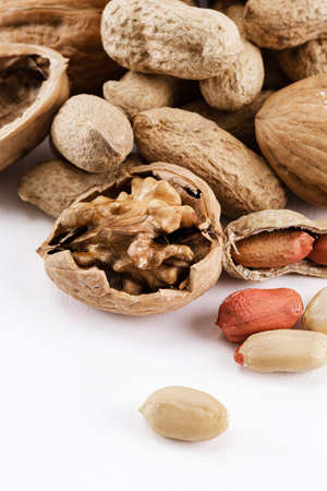 peanuts and walnuts in white background