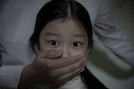 depressed Asian child in fear due to child abuse and violence, Human Rights Day conceptの写真素材