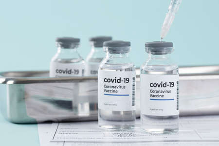 Covid vaccine, syringe and test strip