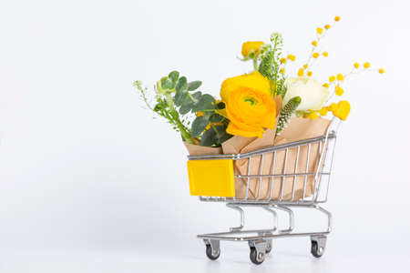 flowers in mini cart, white backgroundの写真素材