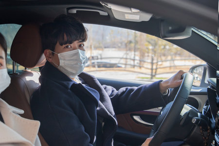 wearing mask in car,  virusの写真素材