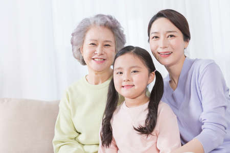 three generations of women, Asian grandmother, mother and grand daughterの写真素材