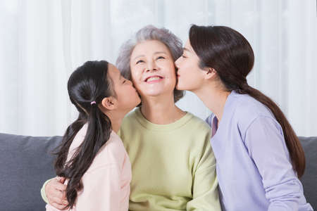 three generations of women, Asian grandmother, mother and grand daughterの写真素材