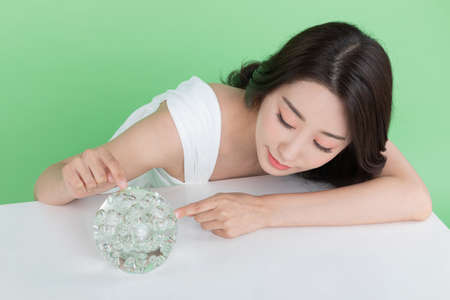 skin beauty concept, beautiful Korean Asian woman holding collagen