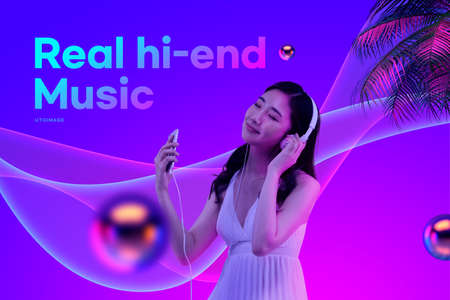 Asian model with headphones listening to real high end music