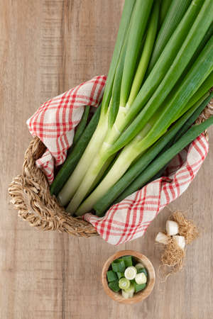 green spring onion in basketの写真素材
