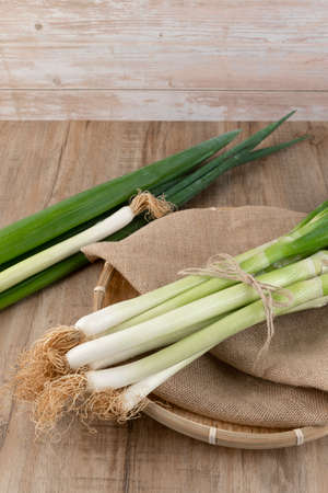 green spring onion in basketの写真素材