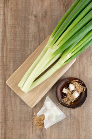 green spring onion and rootsの写真素材