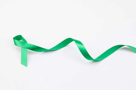 green ribbon on white backgroundの写真素材