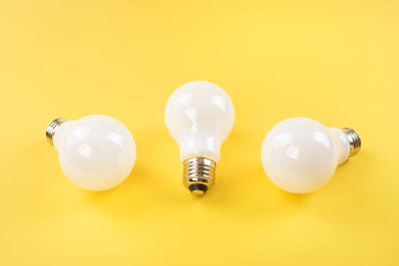 Opaque white bulbs on yellow background