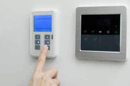 hand checking power consumption rateの写真素材