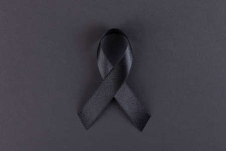 Black ribbon on black backgroundの写真素材