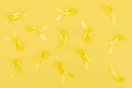 Yellow ribbons on yellow backgroundの写真素材