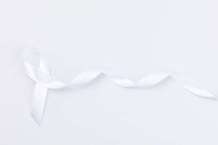 White ribbon on white backgroundの写真素材