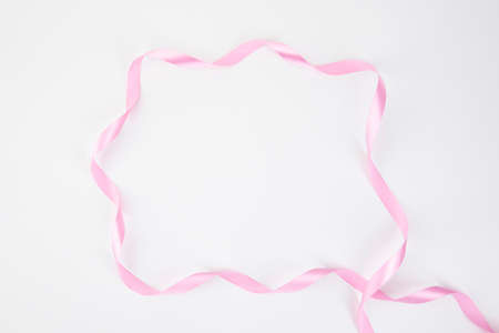 long pink ribbon, white backgroundの写真素材