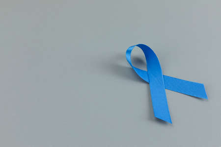 Blue ribbon on gray backgroundの写真素材
