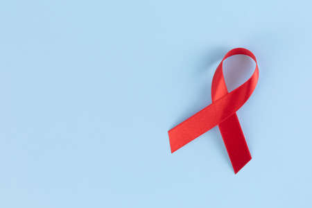 Red ribbon on sky blue backgroundの写真素材