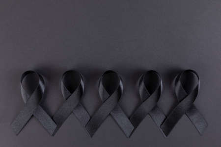 Black ribbons on black backgroundの写真素材