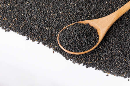 black sesame seeds on hands