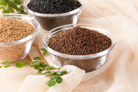 Sesame, perilla, black sesame contained in glass bowl