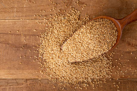 sesame seed in wooden spoonの写真素材