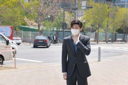 Asian man employee with mask coughing due to fine dust