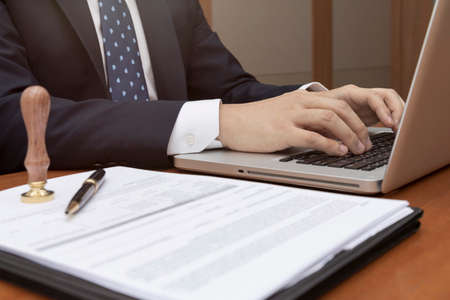 attorney, judge using laptop