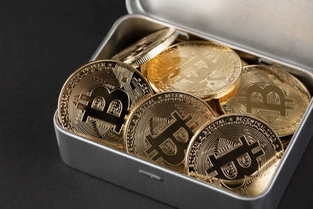 tin case filled with bitcoin, cryptocurrency conceptの写真素材
