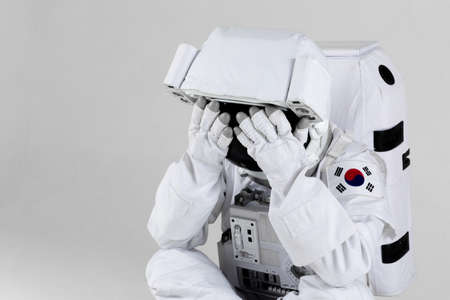 Frustrated astronaut, white backgroundの写真素材
