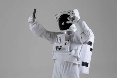 astronaut take selfie pictures, white backgroundの写真素材