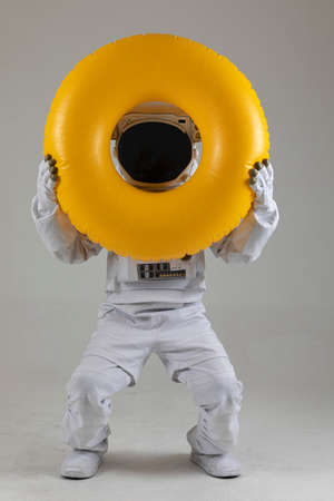 astronaut swimming with tube, white backgroundの写真素材