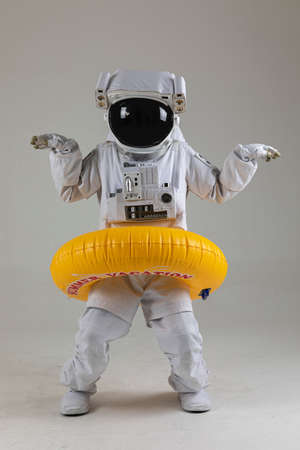 astronaut swimming with tube, white backgroundの写真素材