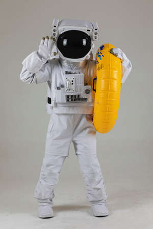 astronaut swimming with tube, white backgroundの写真素材