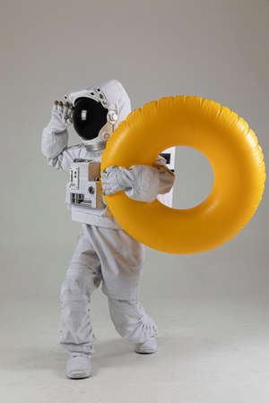 astronaut swimming with tube, white backgroundの写真素材