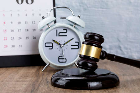 Crime and law-Desktop calendar and alarm clock and gavelの写真素材