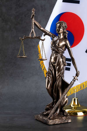 crime and law concept Republic of Korea flag and the Statue of Justiceの写真素材