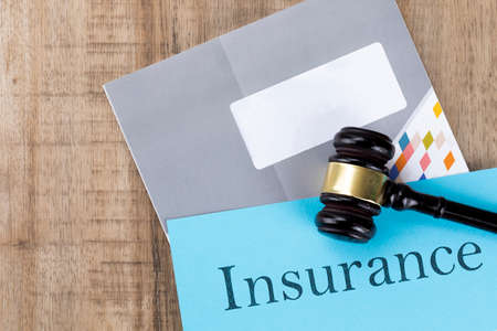 Crime and law - insurance documents and gavelの写真素材