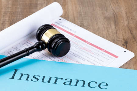 Crime and law - insurance documents and gavelの写真素材