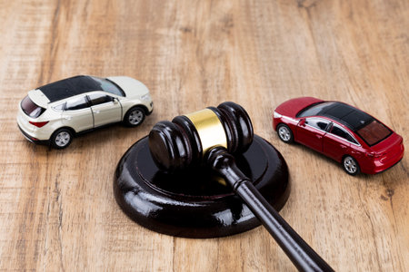 Crime and law - miniature cars and gavelの写真素材