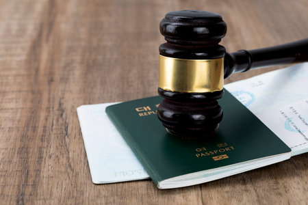 gavel placed on the passport - Crime and the Law