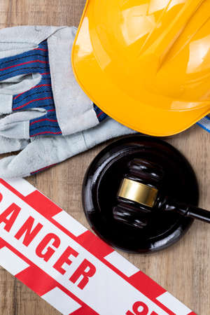 Crime and law - helmet, safety gloves and gavel