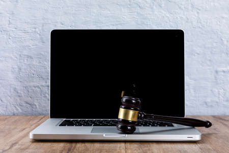 Crime and law - laptop and gavelの写真素材
