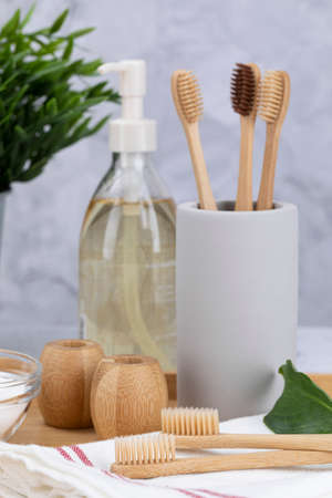 Zero waste - Bamboo toothbrush, baking soda, body oil, potted plantの写真素材