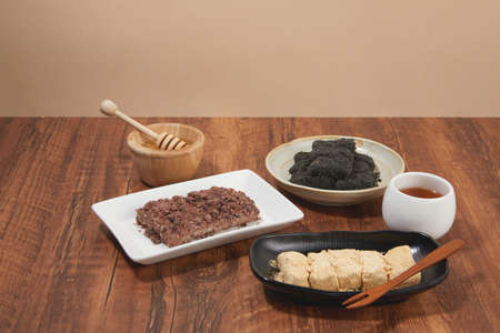 korean traditional dessert set of black bean rice cake, Injeolmi and jujube teaの写真素材
