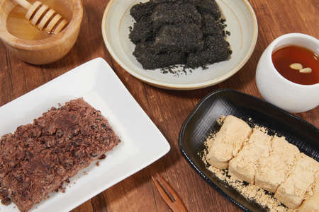 korean traditional dessert set of black bean rice cake, Injeolmi and jujube teaの写真素材