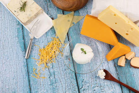 cheese collection, blue wood background