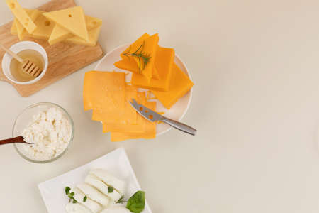 mozzarella cheese and ricotta cheese, cheddar cheese, emmental cheese, ivory backgroundの写真素材