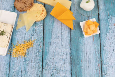 cheese collection, blue wood backgroundの写真素材